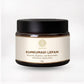 Kumkumadi Lepam Face Cream jar with beige label, black lid, white background.